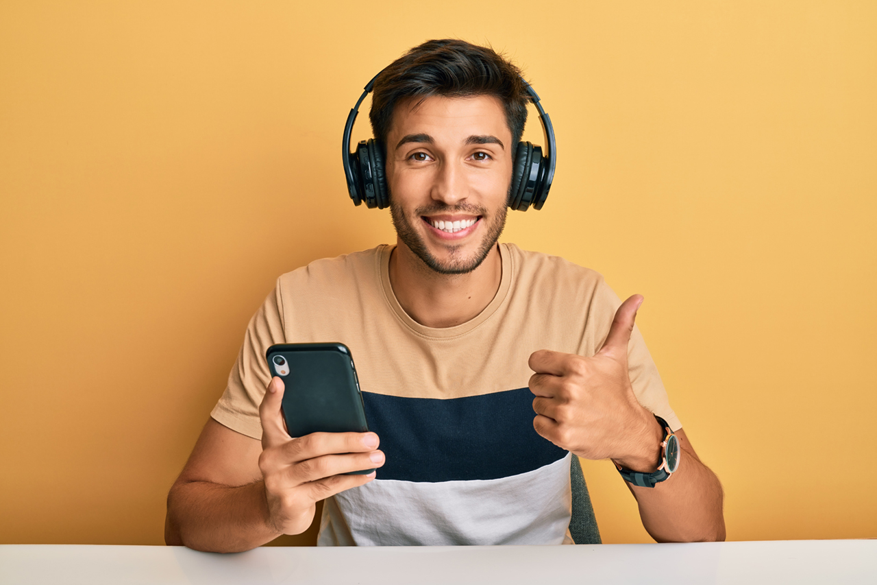 young-handsome-man-using-smartphone-wearing-headphones-smiling-happy-positive-thumb-up-doing-excellent-approval-sign.jpg young-handsome-man-using-smartphone-wearing-headphones-smiling-happy-positive-thumb-up-doing-excellent-approval-sign.jpg